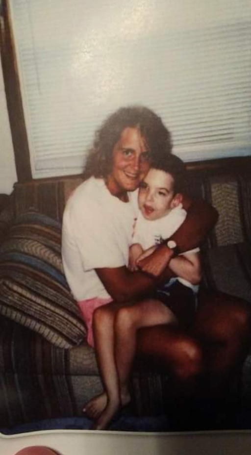 Julie holding Jason in a treasured family photograph